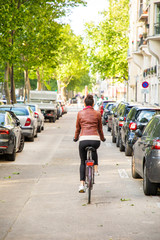 Naklejka premium young woman riding a bike