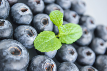 Blueberries and a leaf of fresh mint. Vitamins and antioxidants. Macro view.