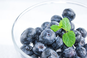 Blueberries and a leaf of fresh mint. Vitamins and antioxidants. Macro view.