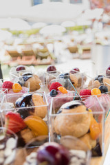 Candy bar food buffet by the pool, during hotel brunch, catering in the garden