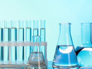 Close-up of glass test tubes and other laboratory glassware