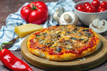 Homemade pizza with mushrooms and cheese.