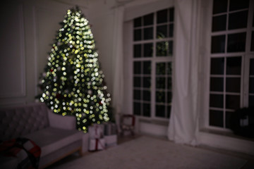 Blurred view of modern living room with Christmas tree