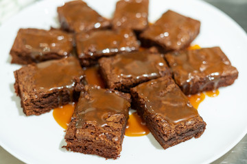 Close-up on white plate with freshly baked brownie