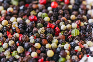 Background of different types of hot peppers .Multicolored pepper in the form of polka dots