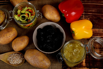 pickled cucumbers plums dried next to potatoes and barley groats