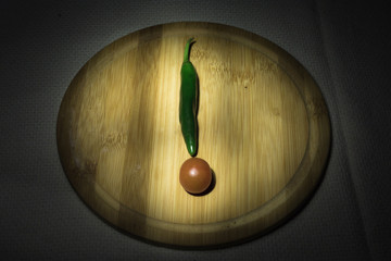 vegetables tomato and pepper in the form of an exclamation mark. the concept eat vegetables