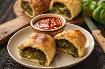 Stromboli with spinach and mozzarella fiiling., italian pizza dough pie.