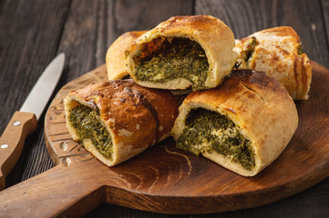 Stromboli with spinach and mozzarella fiiling., italian pizza dough pie.