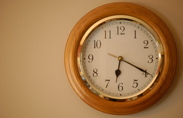 Vintage clock on a brown/white background