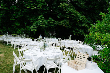 photo of an empty wedding dinner tables in the garden