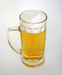 large glass mug with a handle with beer and foam on a white background