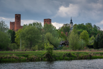 Castle and Czerskie lake at sunny spring day in Czersk, Poland