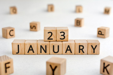 January 23 - from wooden blocks with letters, important date concept, white background random...