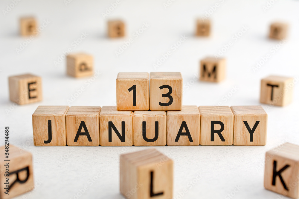 Poster january 13 - from wooden blocks with letters, important date concept, white background random letter