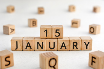 January 15 - from wooden blocks with letters, important date concept, white background random letters around