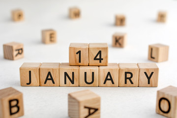 January 14 - from wooden blocks with letters, important date concept, white background random letters around