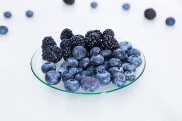 Blueberries and blackberries berries close-up.