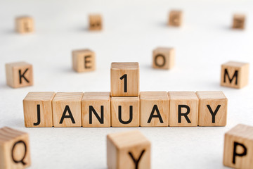 January 1 - from wooden blocks with letters, important date concept, white background random letters around