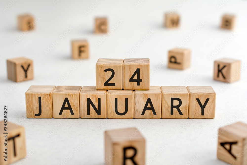Poster january 24 - from wooden blocks with letters, important date concept, white background random letter