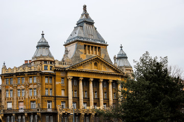 Facade of yellow historical building in Deak Ferenc square, Budapest.