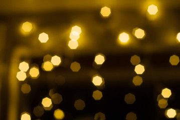 Fototapeta premium Yellow Christmas Background of round light bulbs With bokeh
