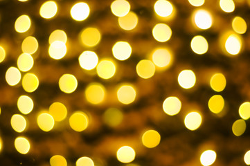 Abstract blurred background of yellow garland lights, bokeh. Christmas.