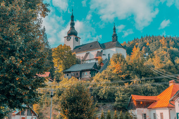 A beautiful church in a hill in Spania Dolina Village, Slovakia - obrazy, fototapety, plakaty