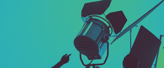Flash light on tripod in studio production set up for professional photographer shooting photo or...