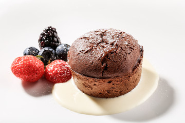 Fresh sweet muffins with berries inside.