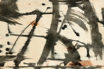 abstract grunge background, artistic painting with black paint on a light wooden background,...