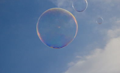 Soap bubble floating in the air as the blue sky