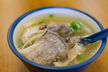 Close up of a bowl of delicious fish soup
