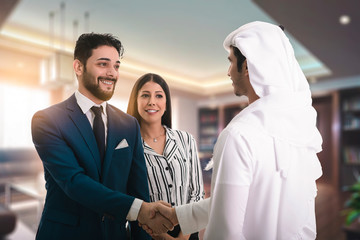 Man in suit shake hand of Arabic business man as hello in office. offer job position, Great thanks...
