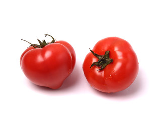 red tomatoes on white background. isolated.  close up shot