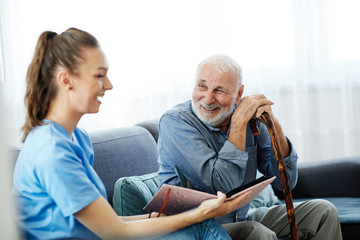 nurse doctor senior care caregiver photo album help assistence retirement home memory nostalgia elderly man