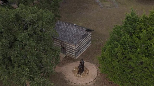 Log Cabin and Some Statues, Bryan, Texas, USA
