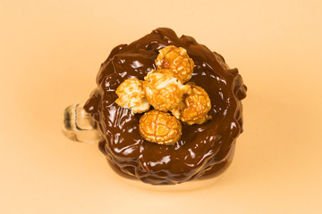 Chocolate milkshake with whipped cream, cookies, waffles, served in glass mason jar. 