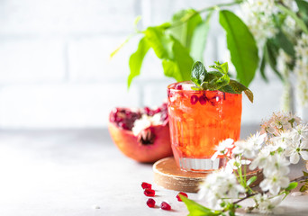 Fresh cold pomegranate lemonade. Homemade lemonade with ice.