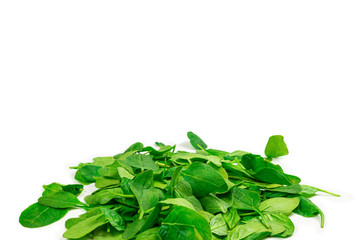 Fresh spinach leaves as background.