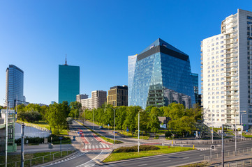 Panoramic view of Gdanski Business Center commercial quarter in northern Srodmiescie district of Warsaw, Poland, with Intraco and North Gate towers in background - obrazy, fototapety, plakaty