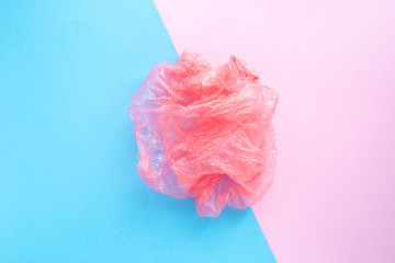 Flatlay crumpled plastic bag. Non-decaying trash. Environmental pollution concept. Ecology and separate sorting of trash. Top view.