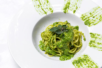 Spaghetti with homemade pesto sauce and oregano