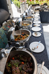 Live food stations. Kitchenware in the line catering summer brunch buffet. Corporate cocktail event