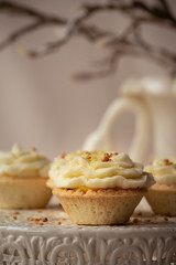 freshly baked and fluffy butter cream cupcakes with lemon juice taste