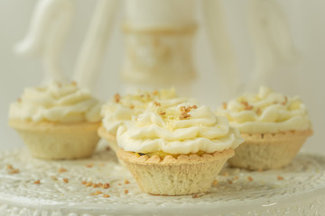 freshly baked and fluffy butter cream cupcakes with lemon juice taste
