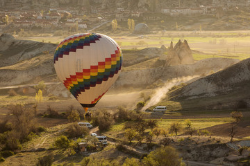 Obraz premium Balloon over Valleys of Cappadocia in background, aerial view