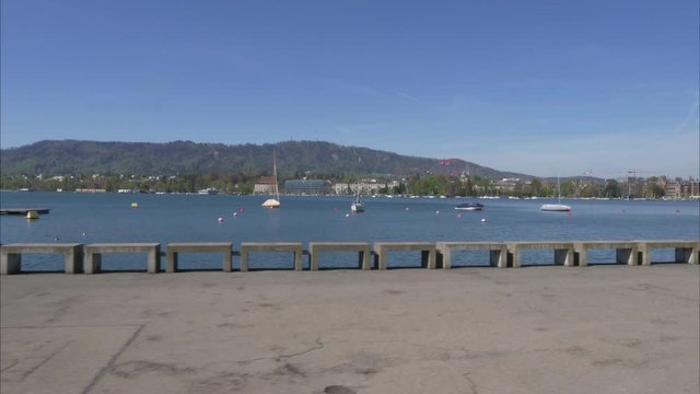hyperlapase zurich city on a sunny day lake, boats, boardwalk