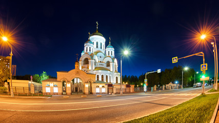 Fototapeta na wymiar russian church in moscow city russia at night against black sky background panorama landmark fisheye view of town street with pedestrian path and traffic lights