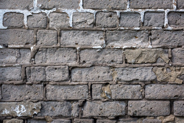  Old gray brick wall background or texture, close up.